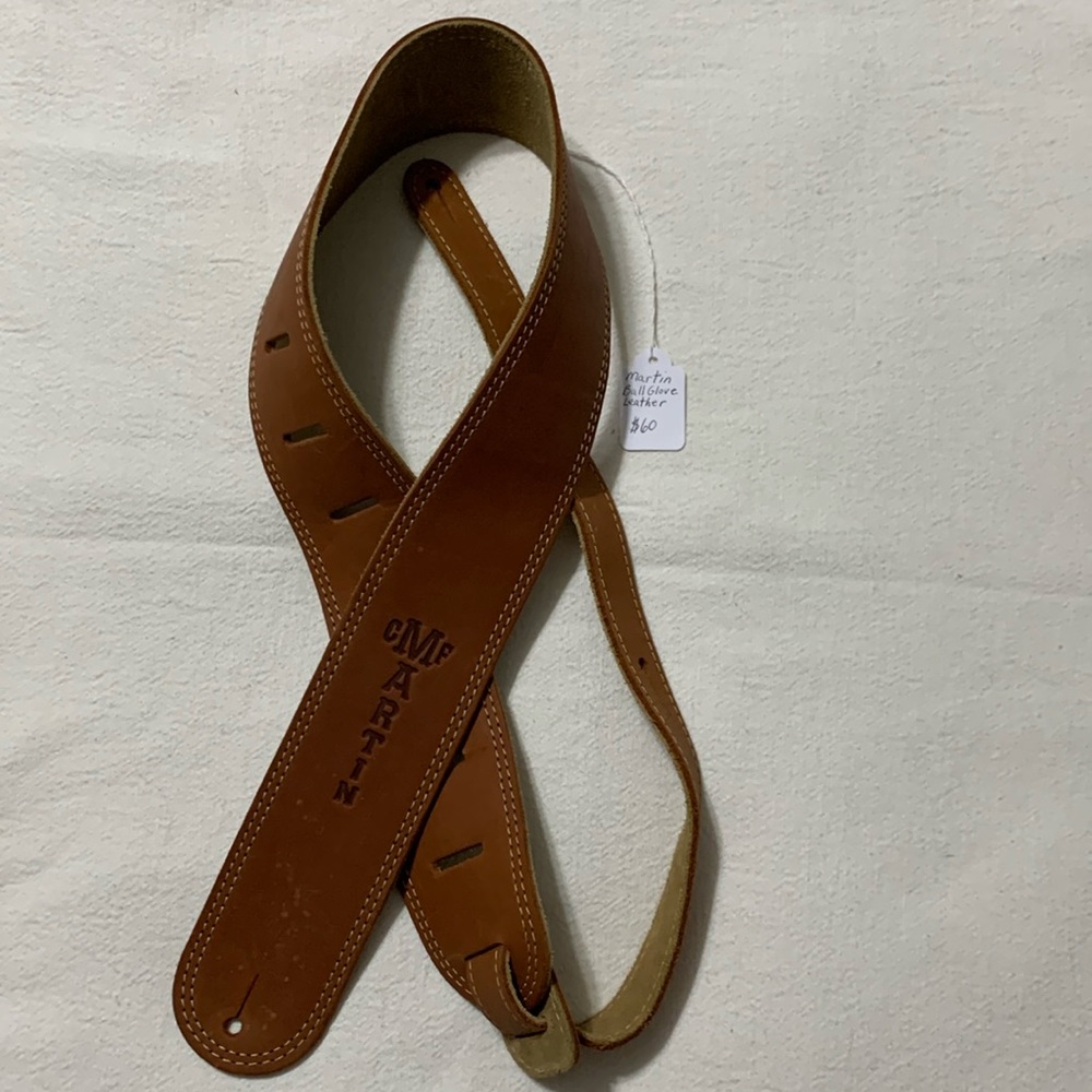Martin guitar strap ball glove leather see pictures for measurements. Preowned.